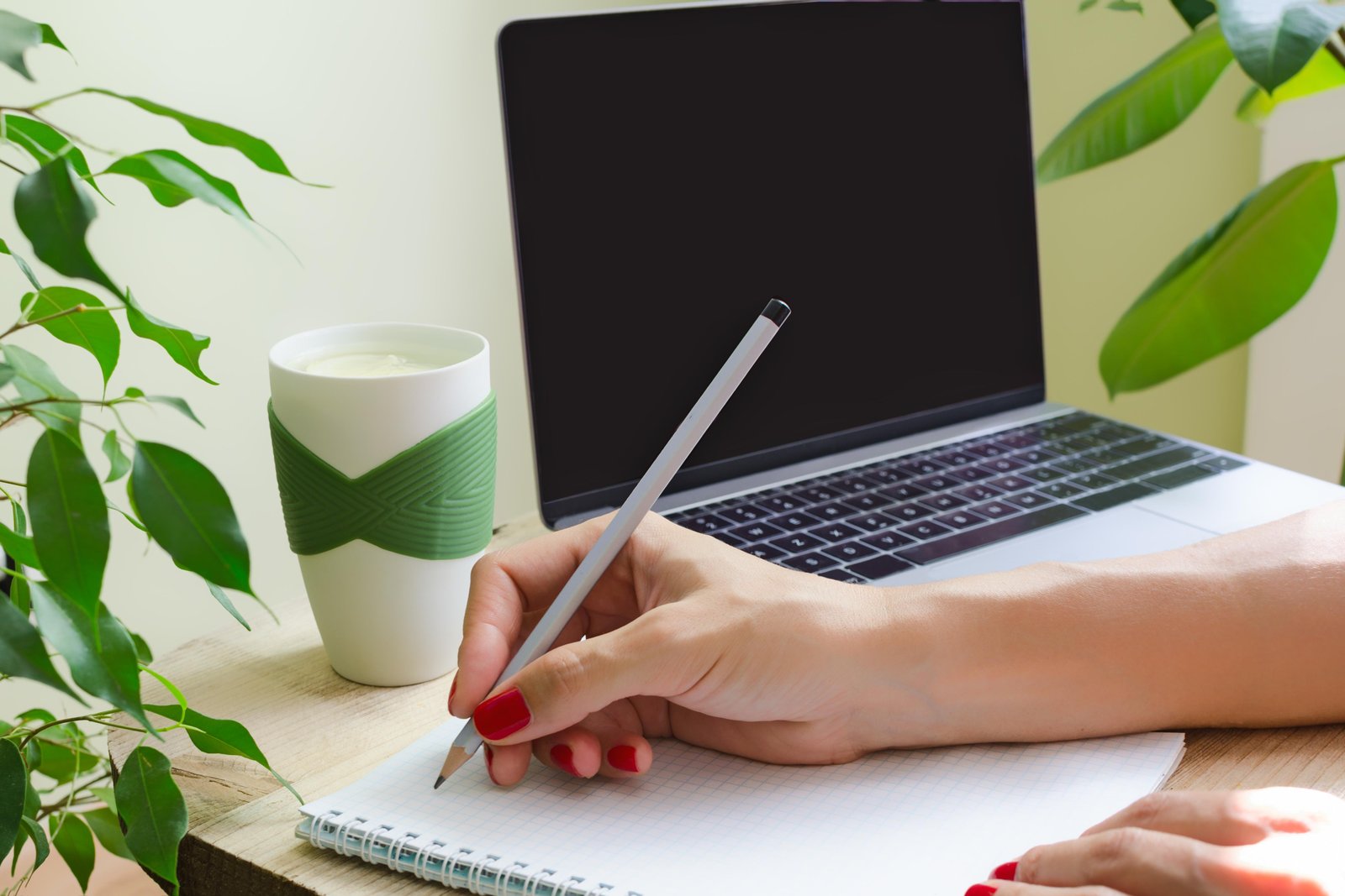 a-woman-writes-in-pencil-in-the-diary-2024-11-27-13-34-58-utc