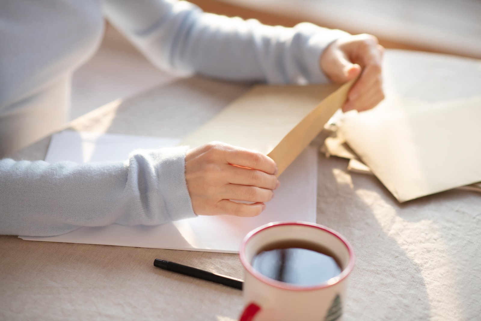 young-cute-woman-in-grey-homewesar-reading-letters-2024-10-18-04-28-15-utc